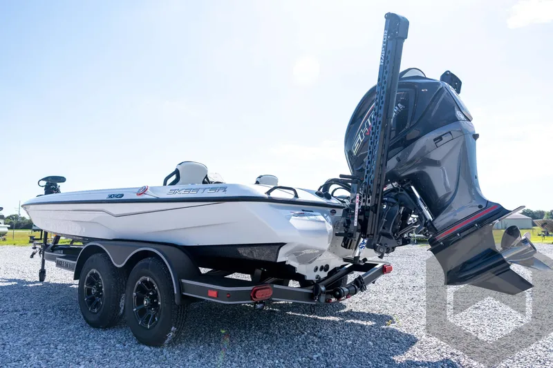 Slide: The Image of 2026 Skeeter ZXE21 boat on trailer with powerful outboard motor. - 28