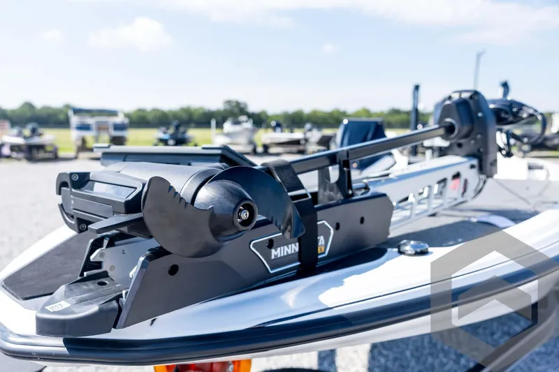 Slide: The Image of 2026 Skeeter ZXE21 boat with Minn Kota trolling motor, outdoor setting. - 35