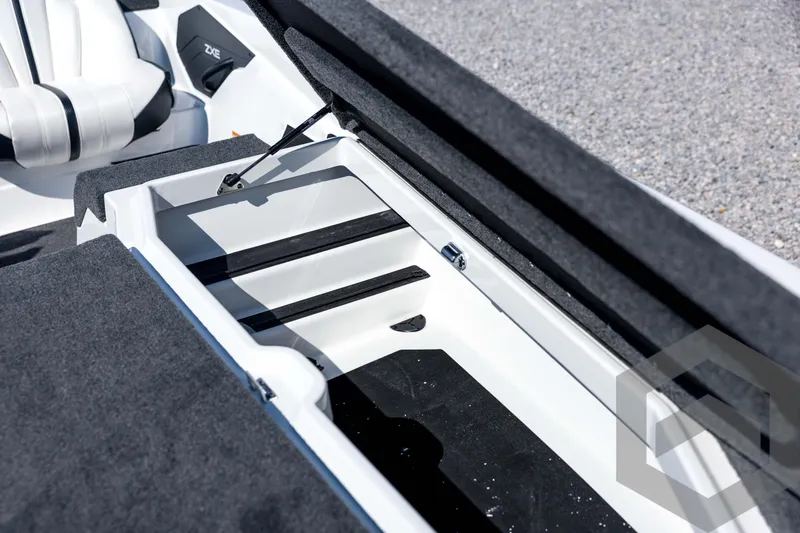 Slide: The Image of Interior view of 2026 Skeeter ZXE21 boat storage compartment with seating. - 46