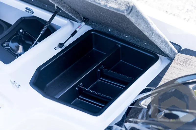 Slide: The Image of Open storage compartment in 2026 Skeeter ZXE21 boat, featuring organized interior layout. - 49