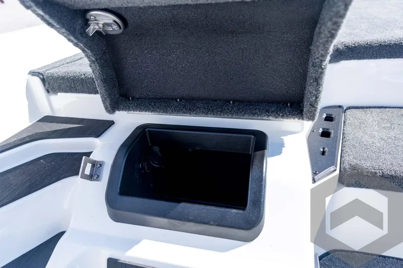 Slide: The Image of 2026 Skeeter ZXE21 boat storage compartment with open lid, showcasing interior space. - 52