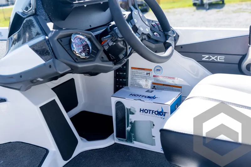 Slide: The Image of Interior of 2026 Skeeter ZXE21 boat with steering wheel and Hot Foot throttle box. - 54