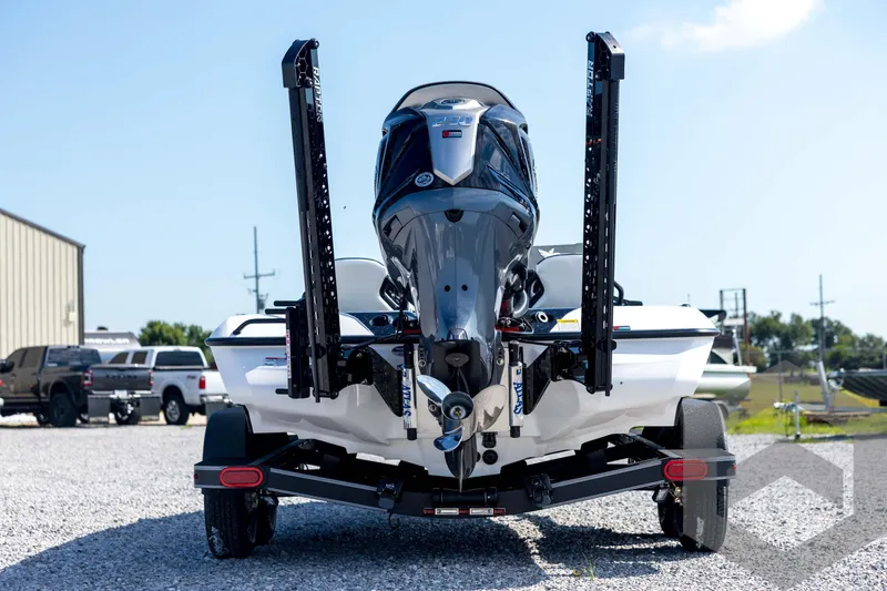 Slide: The Image of 2026 Skeeter ZXE21 boat on trailer, rear view with motor and power poles. - 6