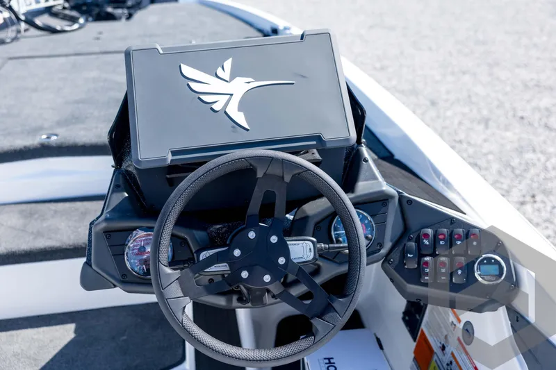 Slide: The Image of Steering console of 2026 Skeeter ZXE21 boat with modern controls and display. - 61