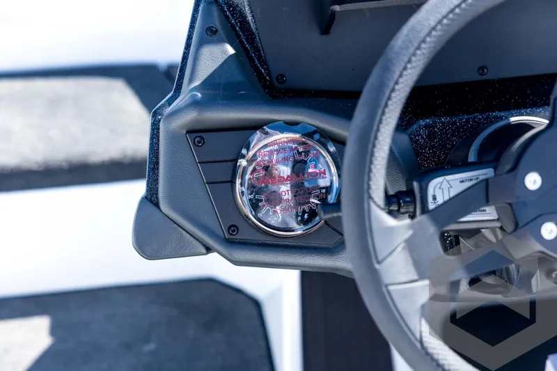 Slide: The Image of Dashboard of 2026 Skeeter ZXE21 boat with steering wheel and gauge. - 63