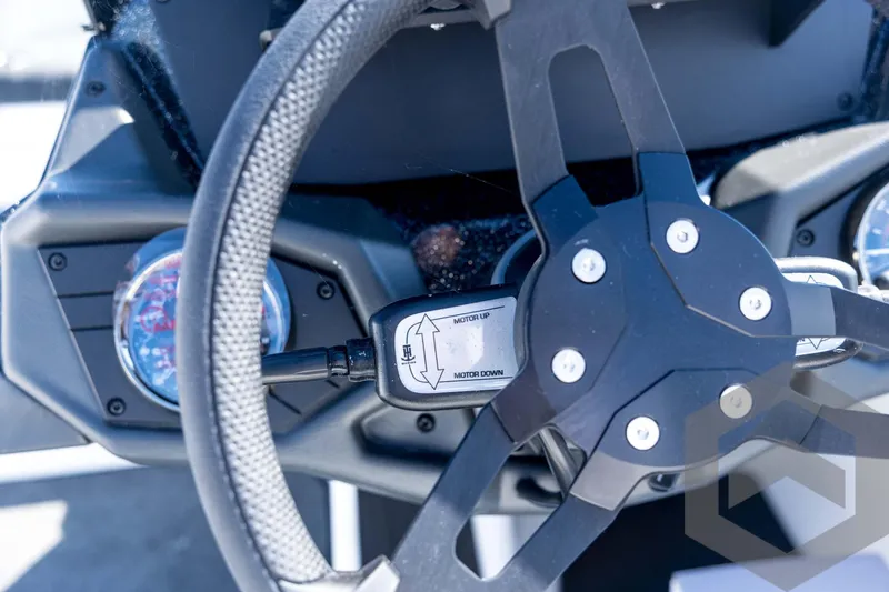 Slide: The Image of Steering wheel of 2026 Skeeter ZXE21 boat with motor control lever. - 66