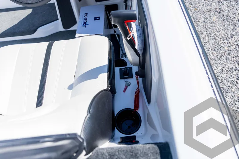 Slide: The Image of Interior of 2026 Skeeter ZXE21 boat showing seat, controls, and cup holder. - 68
