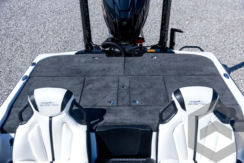 Slide: The Image of 2026 Skeeter ZXE21 boat interior with dual seats and carpeted deck. - 69