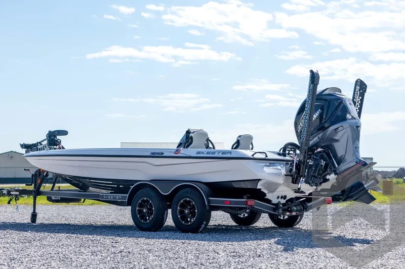 Slide: The Image of 2026 Skeeter ZXE21 boat on trailer, featuring sleek design and powerful engine. - 7