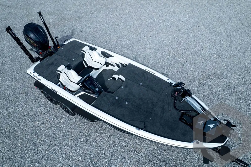 Slide: The Image of 2026 Skeeter ZXE21 fishing boat with dual seats and advanced equipment on a gravel surface. - 84