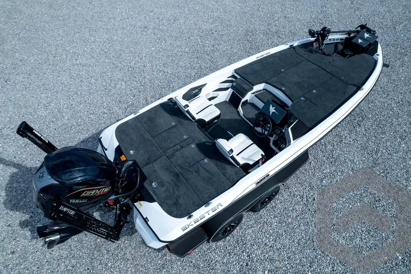 Slide: The Image of 2026 Skeeter ZXE21 fishing boat with Yamaha engine, aerial view on gravel surface. - 86