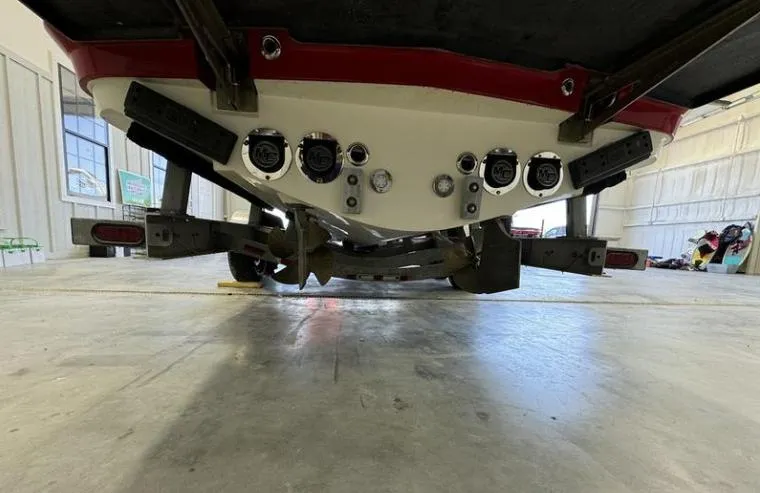 Slide: The Image of Rear view of a 2009 MasterCraft CSX 265 SS boat on a trailer in a garage. - 3