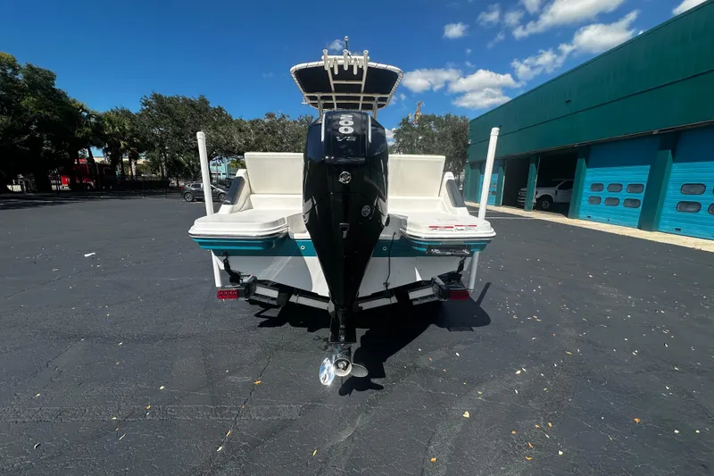 Slide: The Image of 2022 Trophy T22 boat with powerful outboard motor in sunny parking lot. - 4