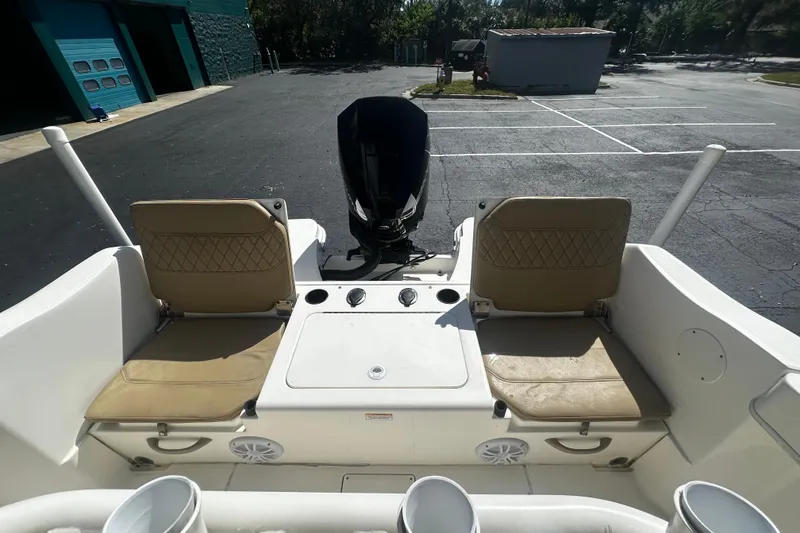 Slide: The Image of 2022 Trophy T22 boat interior with dual seats and engine view. - 7