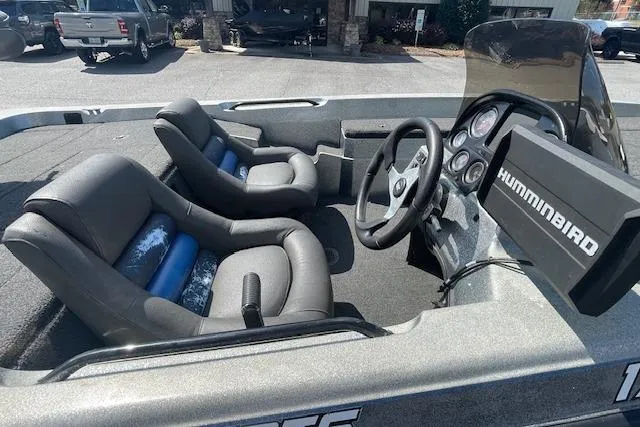 Slide: The Image of 1996 Hydra-Sports 175E boat interior with steering wheel, seats, and Humminbird fish finder. - 7