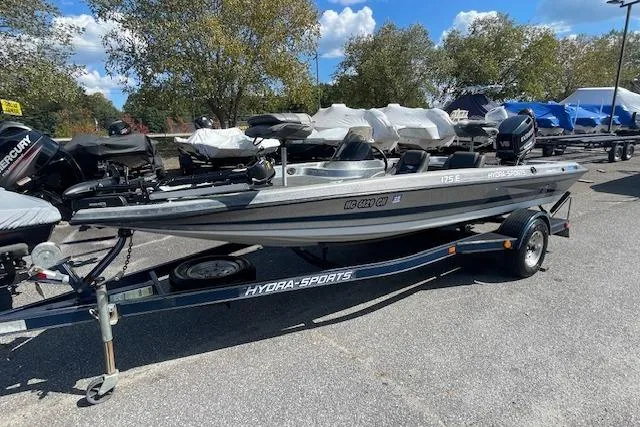 Slide: The Image of 1996 Hydra-Sports 175E boat on trailer, parked outdoors under a clear sky. - 8