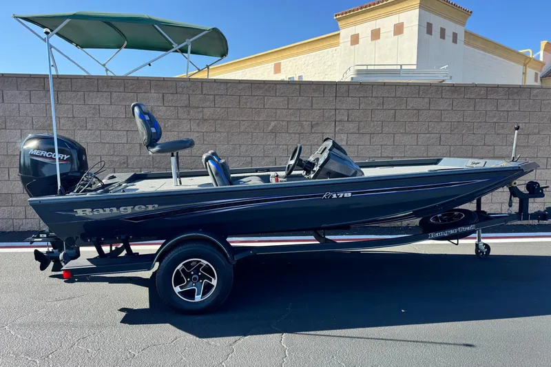 The Image of 2021 Ranger RT178 boat with Mercury engine, parked on trailer, side view. - 0
