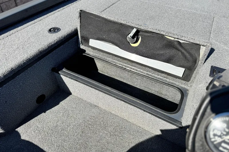 Slide: The Image of 2021 Ranger RT178 boat storage compartment with open lid, showcasing interior space. - 11