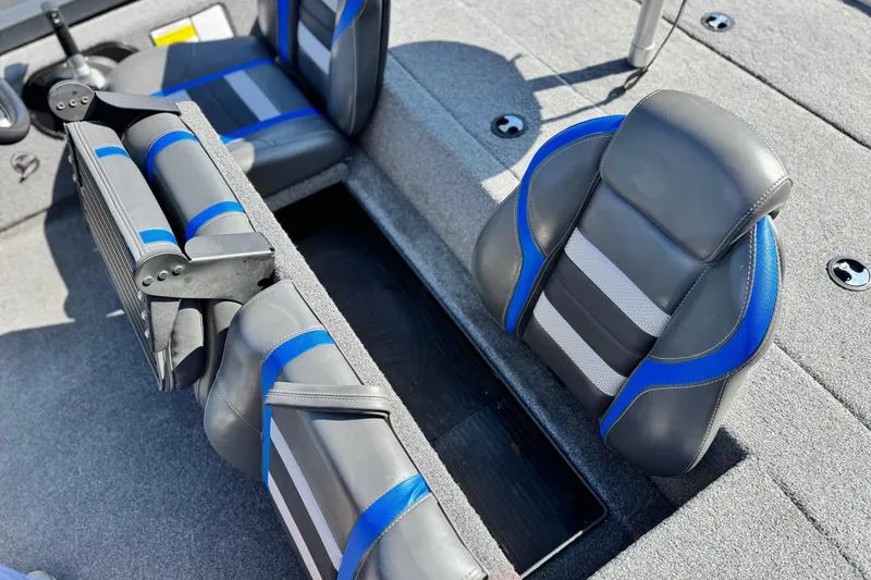 Slide: The Image of 2021 Ranger RT178 boat interior with gray and blue seating. - 12
