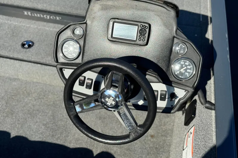 Slide: The Image of 2021 Ranger RT178 boat dashboard with steering wheel and gauges. - 16