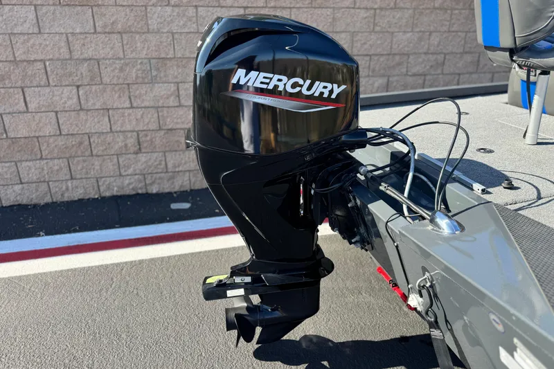 Slide: The Image of 2021 Ranger RT178 boat with Mercury outboard motor, parked on pavement. - 6