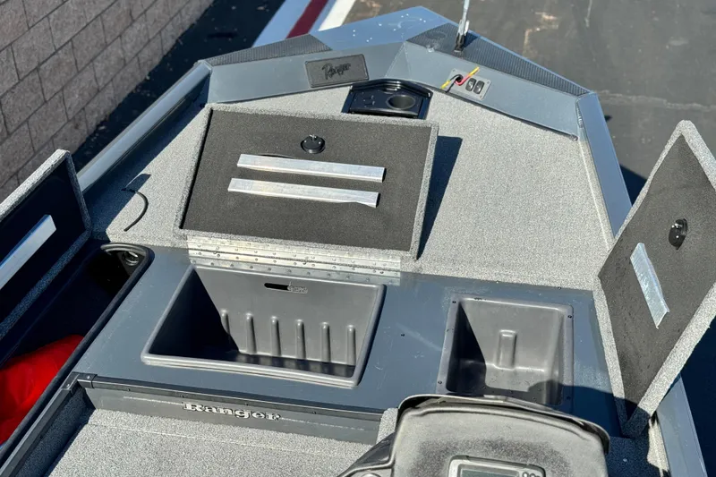 Slide: The Image of 2021 Ranger RT178 boat deck with storage compartments and control panel. - 8