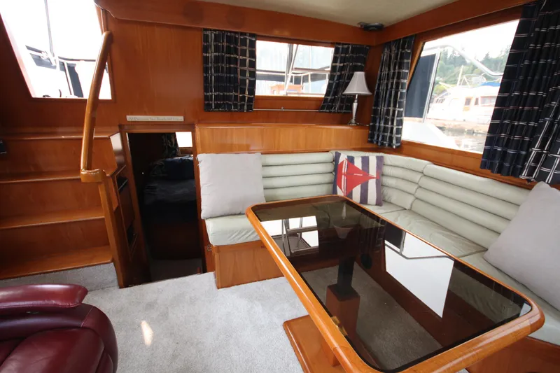Slide: The Image of Interior of 1989 Ocean Alexander 420 Cockpit Motor Yacht with cozy seating and table. - 20