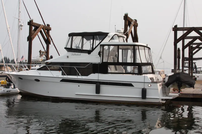 Slide: The Image of 1989 Ocean Alexander 420 Cockpit Motor Yacht docked at marina. - 3