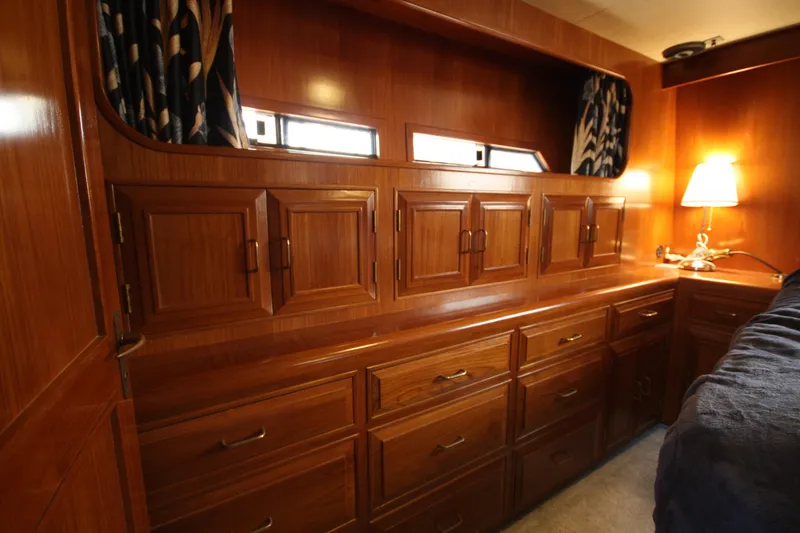 Slide: The Image of Luxurious wooden interior of 1989 Ocean Alexander 420 Cockpit Motor Yacht cabin. - 35