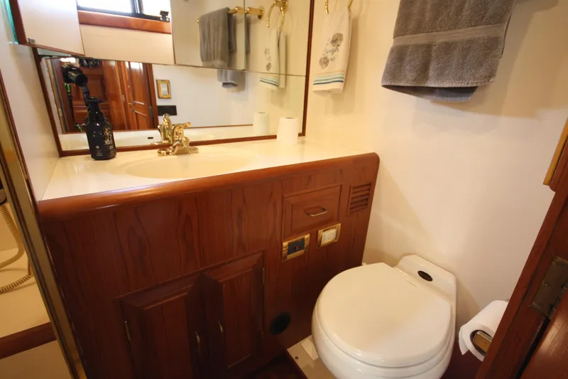 Slide: The Image of Bathroom interior of 1989 Ocean Alexander 420 Cockpit Motor Yacht with wooden cabinetry. - 37