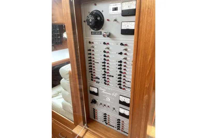 Slide: The Image of Control panel of 1989 Ocean Alexander 420 Cockpit Motor Yacht with switches and gauges. - 41