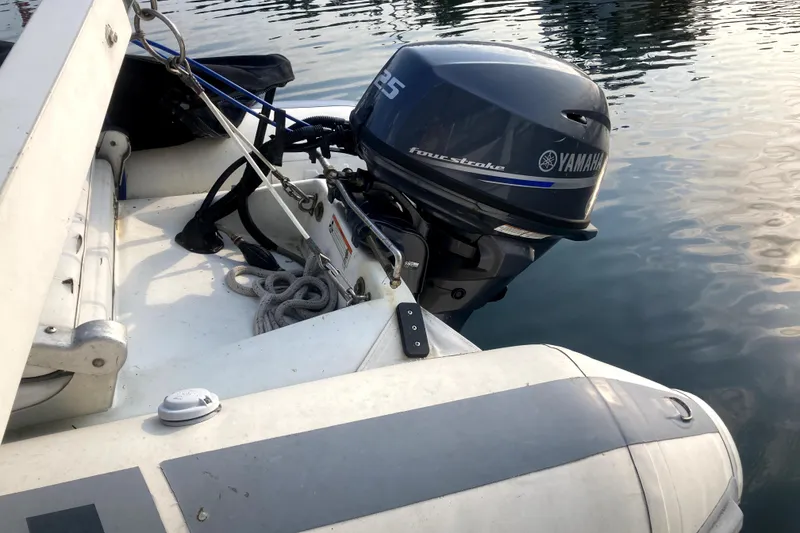 Slide: The Image of Yamaha outboard motor on Ocean Alexander 420 Cockpit Motor Yacht, 1989 model, docked in water. - 50