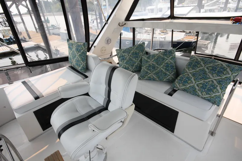 Slide: The Image of Luxurious interior of 1989 Ocean Alexander 420 Cockpit Motor Yacht with plush seating. - 8