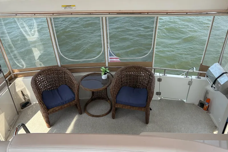 Slide: The Image of Interior view of 2003 Carver 396 Motor Yacht, featuring helm and seating area. - 18