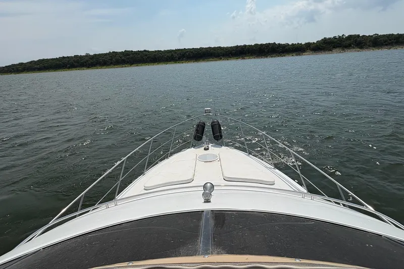 Slide: The Image of Interior of 2003 Carver 396 Motor Yacht with cozy seating and elegant decor. - 25
