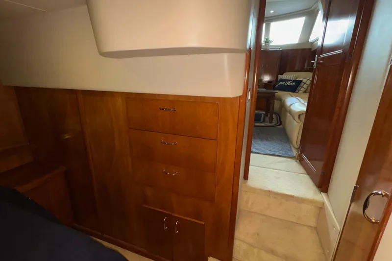Slide: The Image of Luxurious kitchen interior of 2003 Carver 396 Motor Yacht with wood cabinetry and modern appliances. - 41
