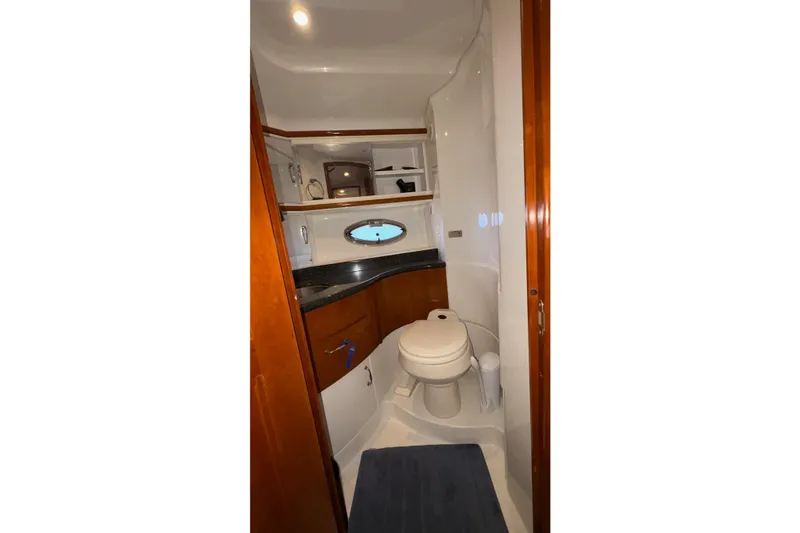 Slide: The Image of Bathroom interior of 2003 Carver 396 Motor Yacht with sink and toilet. - 48