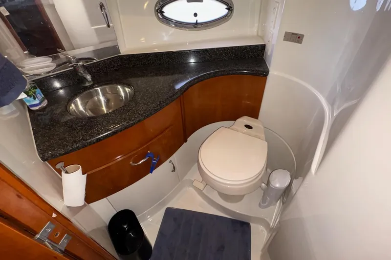 Slide: The Image of 2003 Carver 396 Motor Yacht kitchen with stove, microwave, and granite countertops. - 49