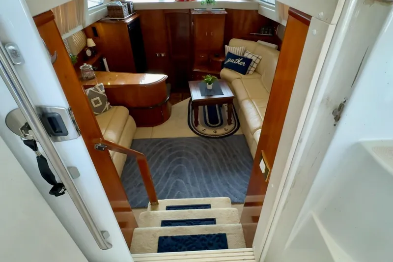 Slide: The Image of Luxurious interior of 2003 Carver 396 Motor Yacht with plush seating and elegant decor. - 26