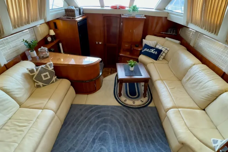 Slide: The Image of Luxurious interior of 2003 Carver 396 Motor Yacht with plush seating and elegant decor. - 27