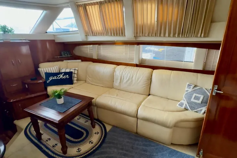 Slide: The Image of Interior of 2003 Carver 396 Motor Yacht with kitchen amenities and wooden cabinetry. - 30