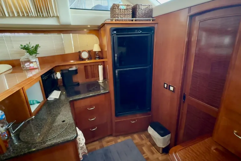 Slide: The Image of Luxurious interior of 2003 Carver 396 Motor Yacht with plush seating and elegant decor. - 31