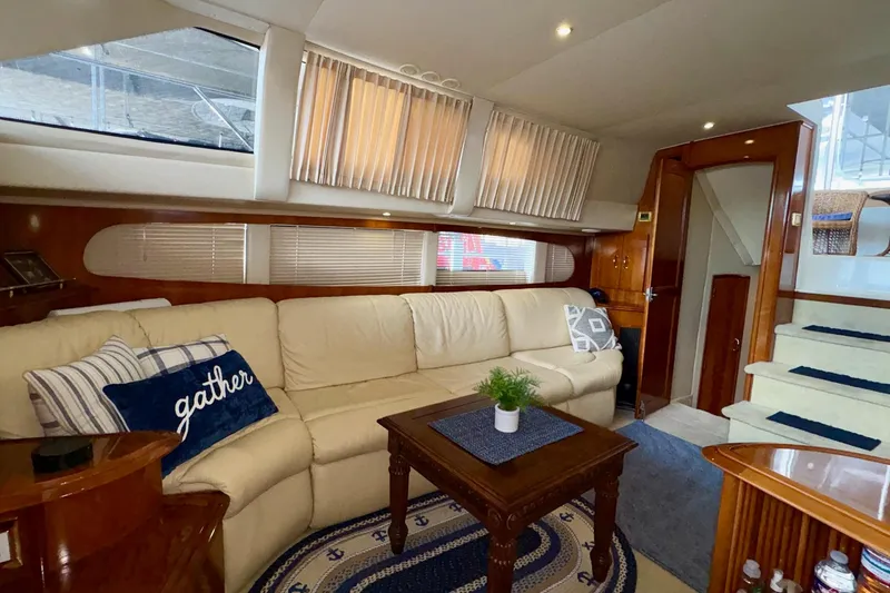 Slide: The Image of Luxurious interior of 2003 Carver 396 Motor Yacht with plush seating and entertainment system. - 32
