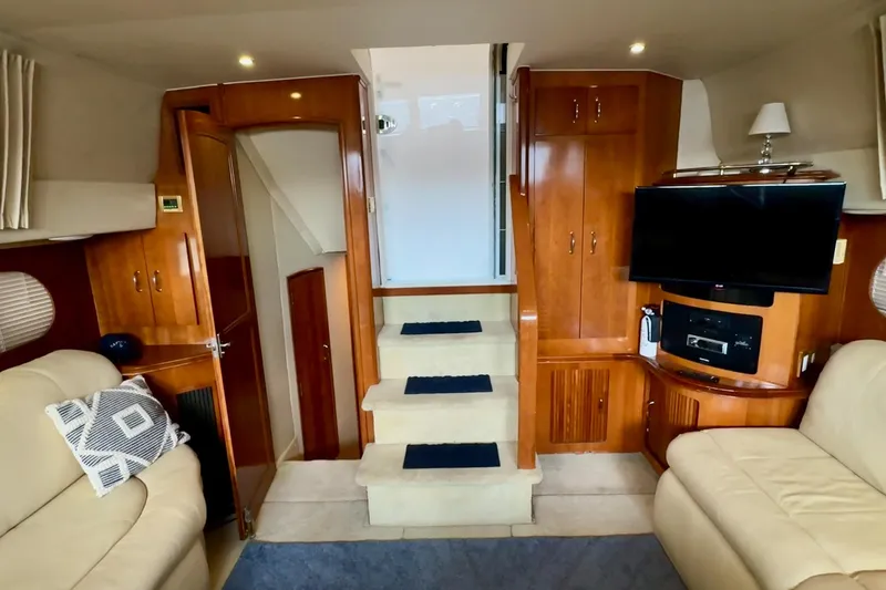 Slide: The Image of Interior view of 2003 Carver 396 Motor Yacht, featuring wooden doors and carpeted stairs. - 34