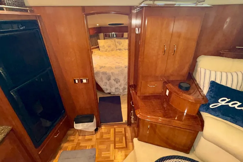 Slide: The Image of Luxurious bedroom interior of 2003 Carver 396 Motor Yacht with elegant wood finishes. - 43