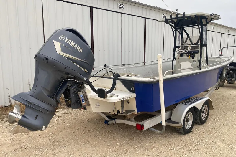 Slide: The Image of 2015 Blazer Bay 2400 boat with Yamaha outboard motor on trailer. - 4