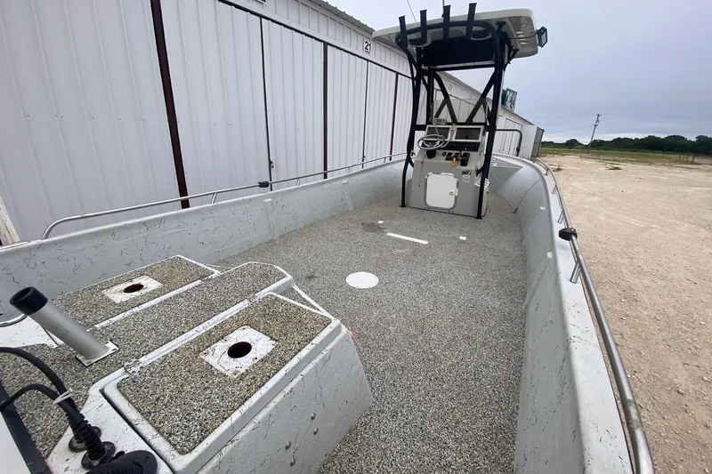 Slide: The Image of 2015 Blazer Bay 2400 boat with spacious deck and control console. - 6