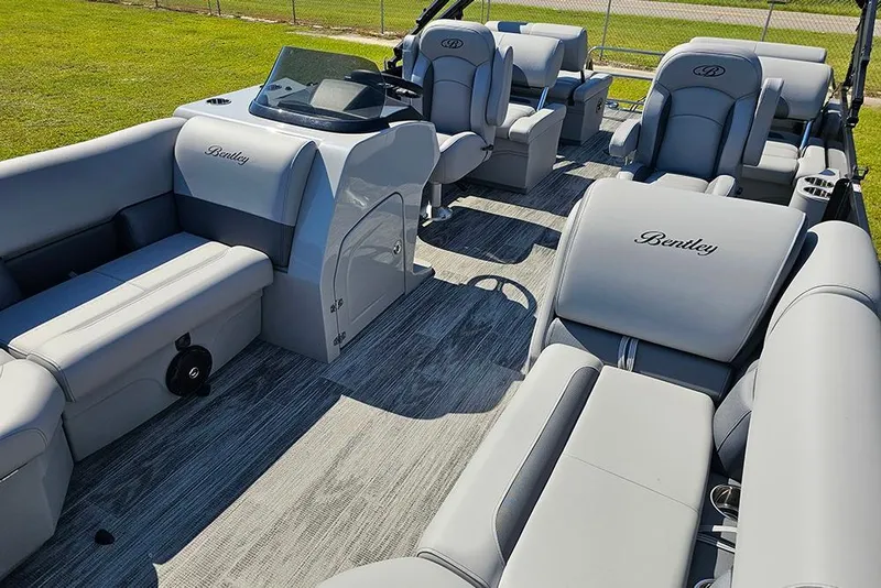 Slide: The Image of 2026 Bentley Pontoons Legacy 223 Quad Swing Back 3/4 Tritoon with luxurious seating and modern design. - 11