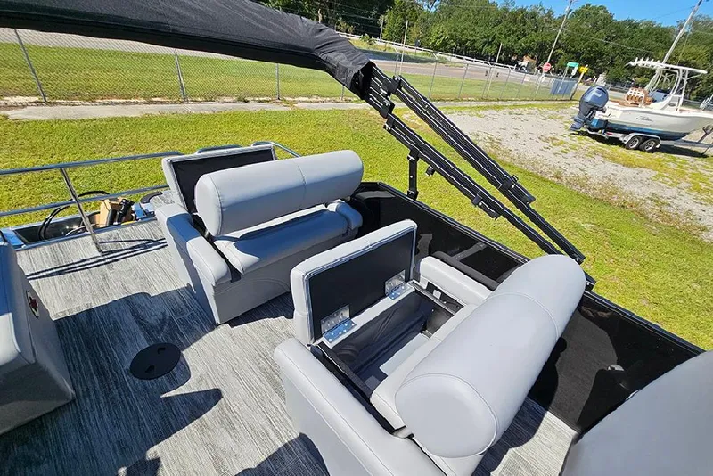 Slide: The Image of 2026 Bentley Pontoons Legacy 223 Quad Swing Back 3/4 Tritoon with gray seating and canopy. - 15