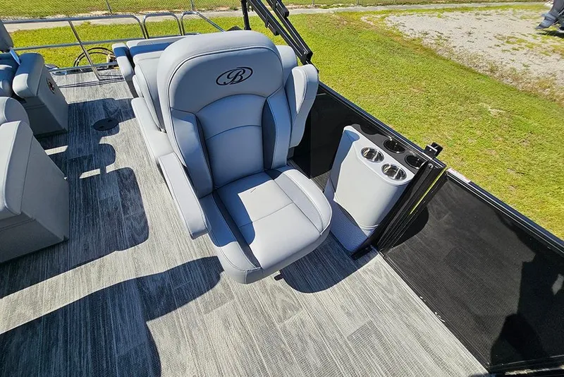 Slide: The Image of 2026 Bentley Pontoons Legacy 223 Tritoon interior with plush seating and cup holders. - 18